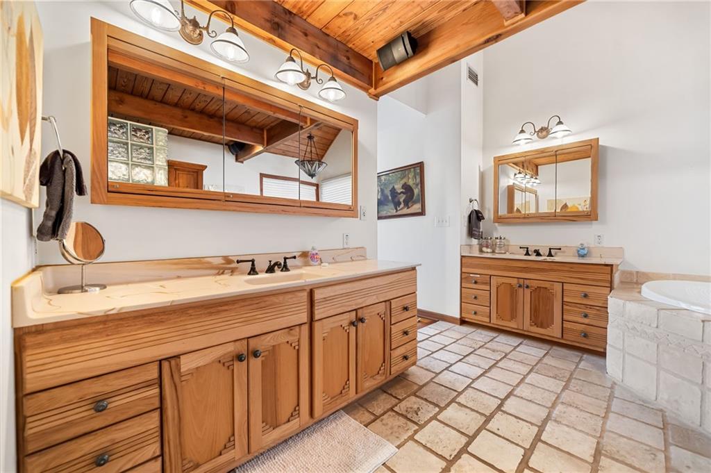 1474 Deer Run Ridge Jasper, GA 30143 - Photo 35 of 50 a kitchen with a stove sink and cabinets