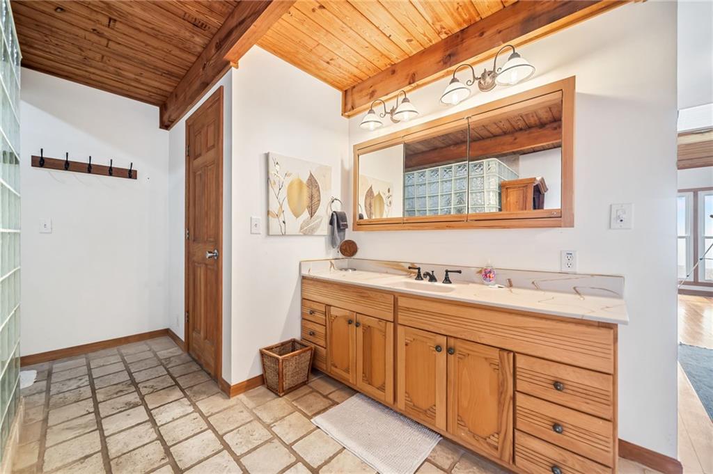 1474 Deer Run Ridge Jasper, GA 30143 - Photo 37 of 50 a spacious bathroom with a sink a mirror and a shower