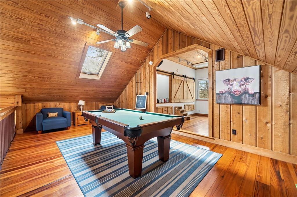 1474 Deer Run Ridge Jasper, GA 30143 - Photo 39 of 50 a room with wooden floor table and chairs