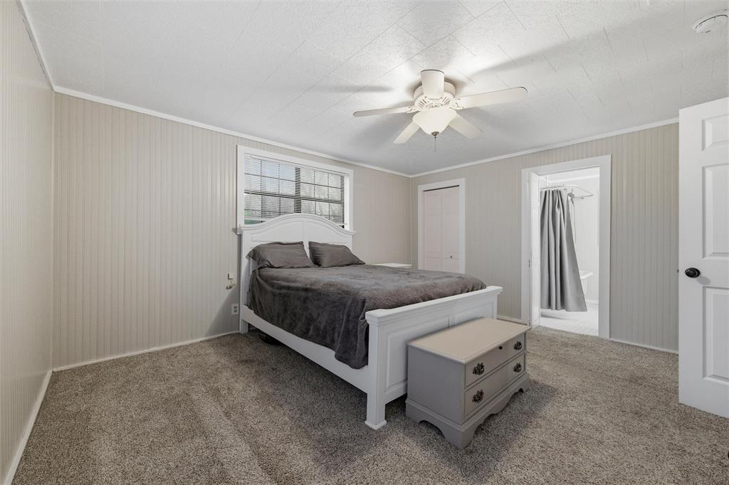 308 Carroll Street Aledo, TX 76008 - Photo 13 of 29 Master Bedroom with ceiling fan and walk in closet.