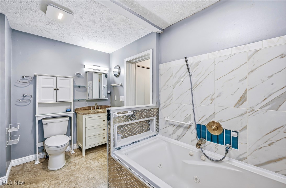 245 North Road Niles, OH 44446 - Photo 21 of 45 Full bath with a textured ceiling and vanity