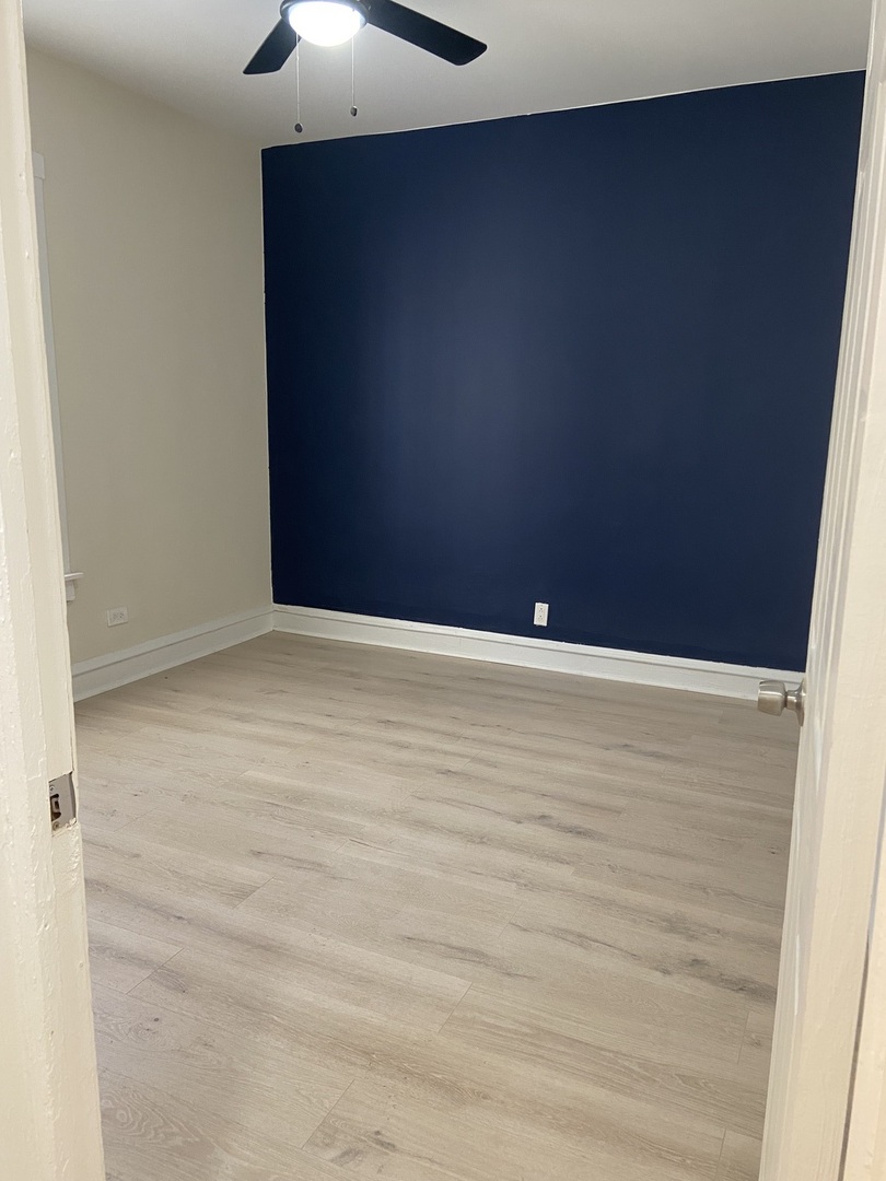 2210 East 70th Street, Unit 1 Chicago, IL 60649 - Photo 3 of 15 a view of an empty room