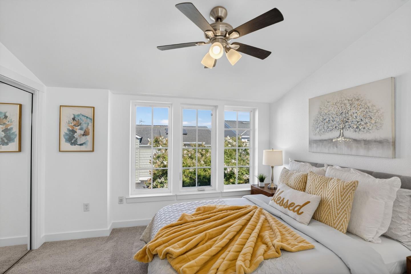 236 Grayson Terrace San Jose, CA 95126 - Photo 17 of 40 a spacious bedroom with a large bed and a large window