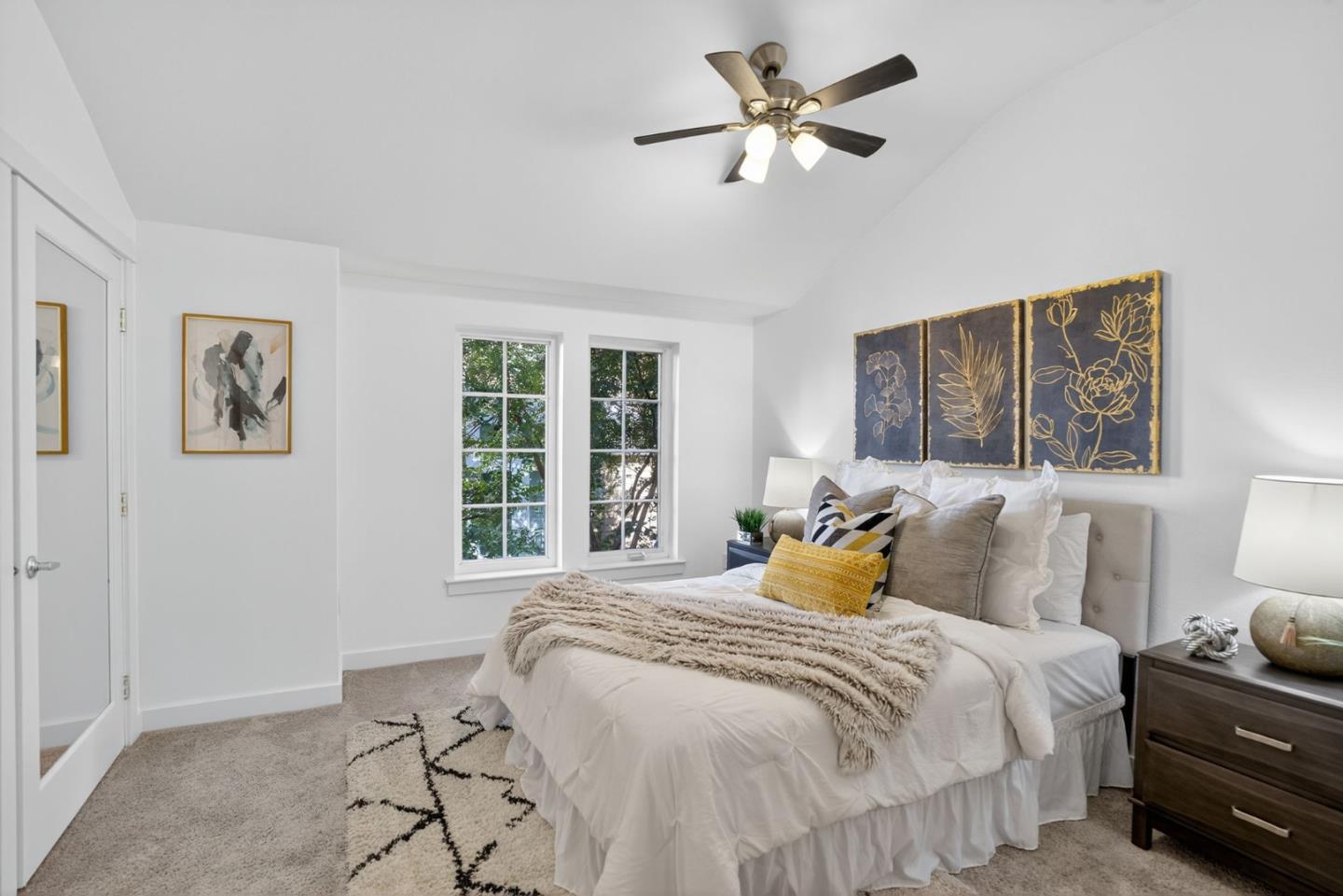 236 Grayson Terrace San Jose, CA 95126 - Photo 9 of 40 a bedroom with a bed a window and a chandelier