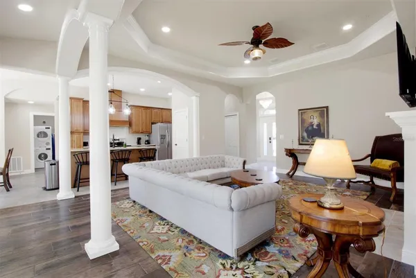 a living room with kitchen furniture and a kitchen view