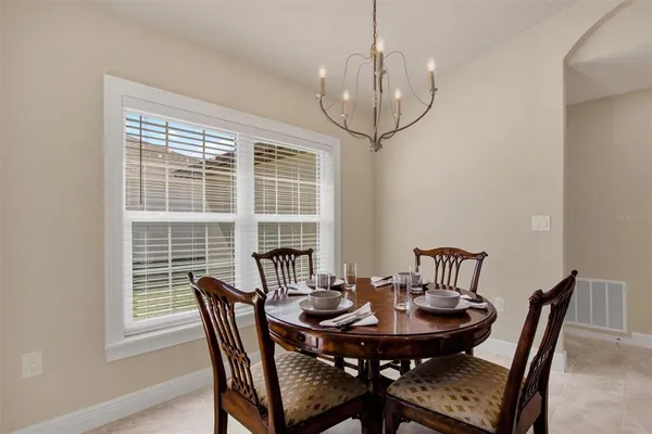 a view of a dining room with furniture window and outside view