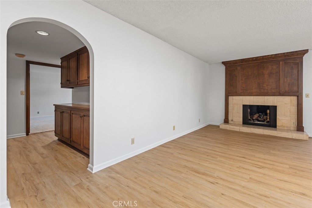 6200 Riviera Circle Long Beach, CA 90815 - Photo 14 of 35 a view of empty room with wooden floor and fireplace