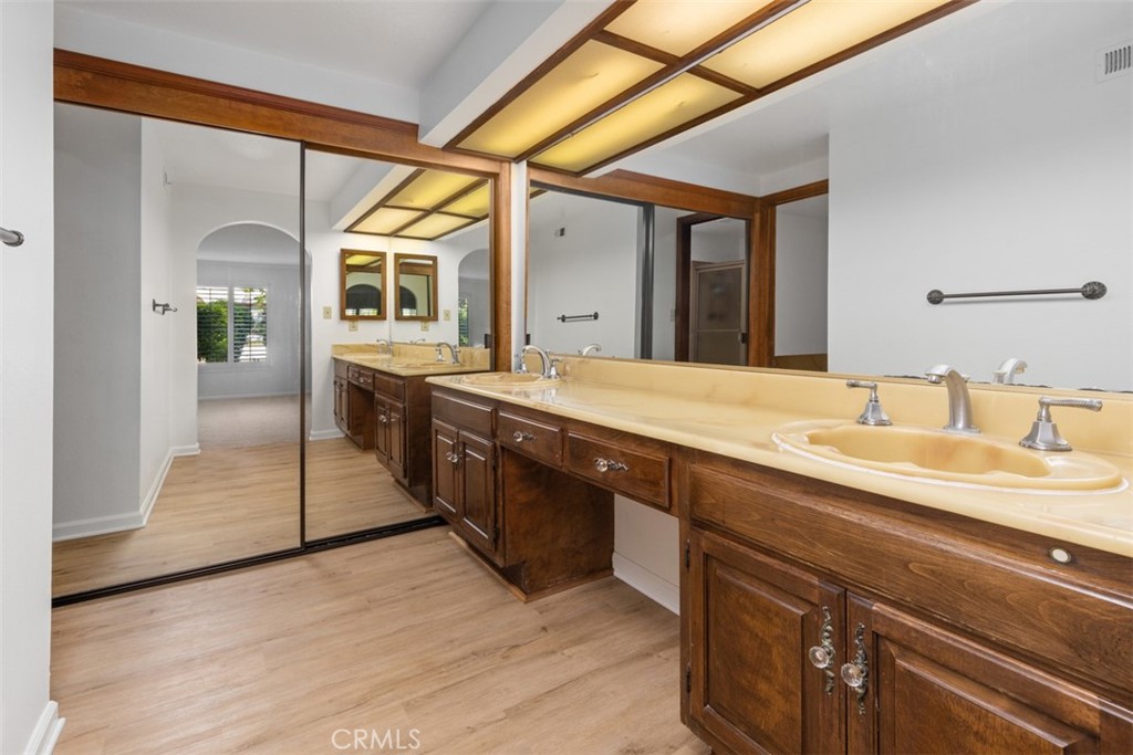 6200 Riviera Circle Long Beach, CA 90815 - Photo 18 of 35 a spacious bathroom with a double vanity sink and a mirror