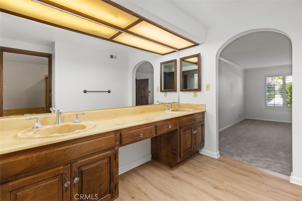 6200 Riviera Circle Long Beach, CA 90815 - Photo 19 of 35 a spacious bathroom with a double vanity sink and a mirror
