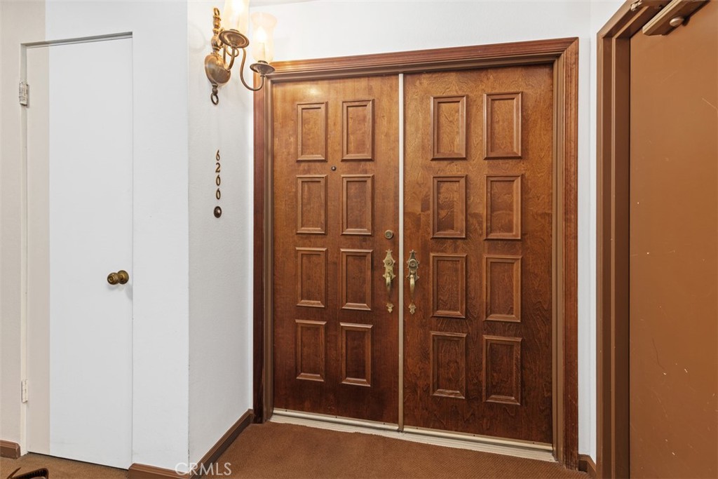 6200 Riviera Circle Long Beach, CA 90815 - Photo 2 of 35 a bathroom with a glass shower door