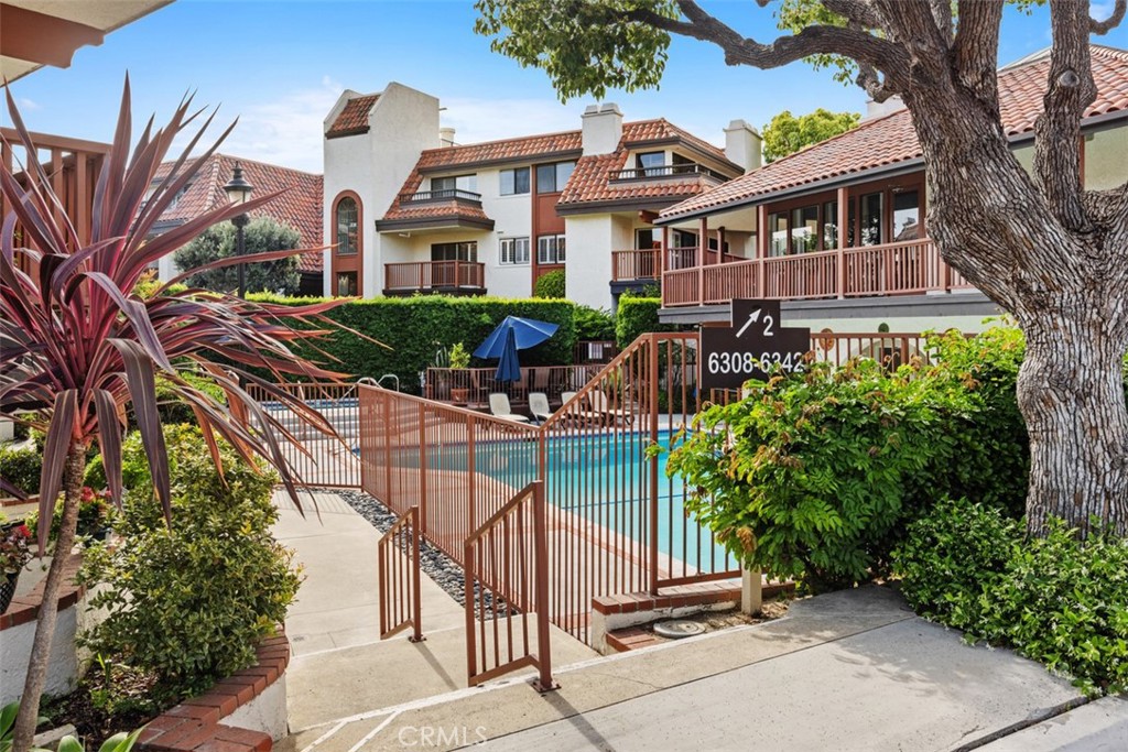 6200 Riviera Circle Long Beach, CA 90815 - Photo 32 of 35 a front view of a house with outdoor seating and a tree