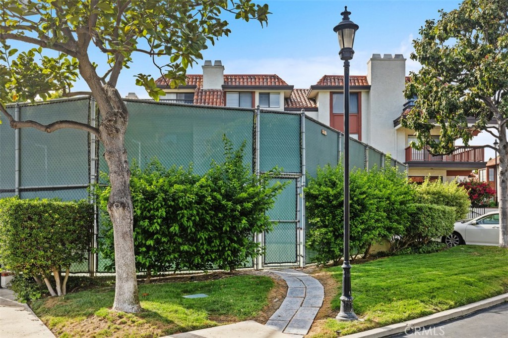 6200 Riviera Circle Long Beach, CA 90815 - Photo 35 of 35 a view of a yard in front of a house with plants and a tree