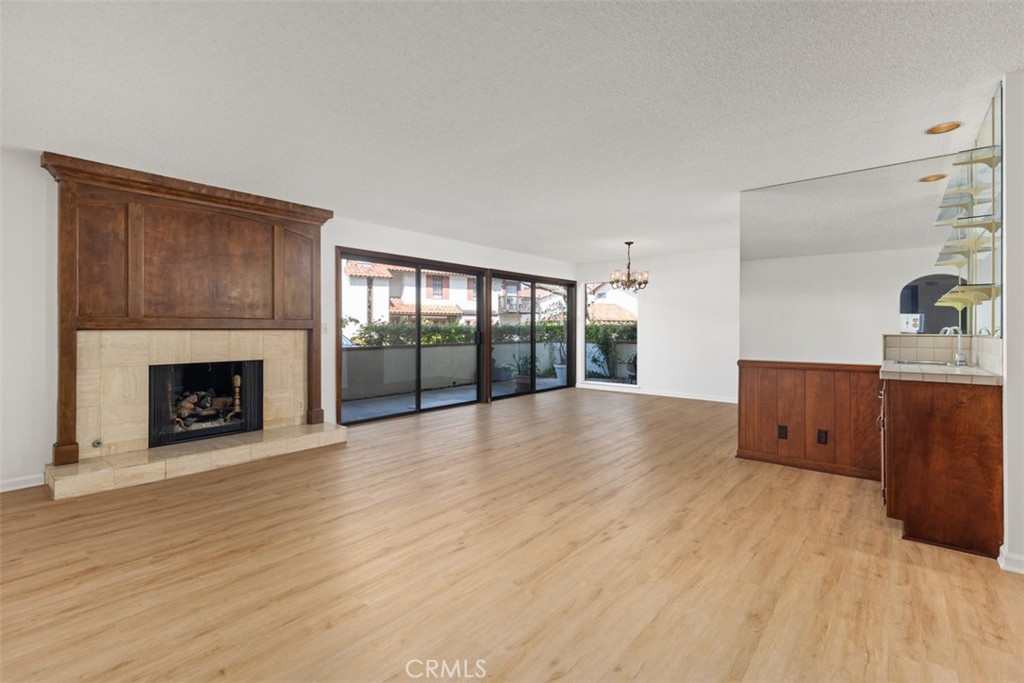 6200 Riviera Circle Long Beach, CA 90815 - Photo 5 of 35 a view of an empty room with a fireplace and a window