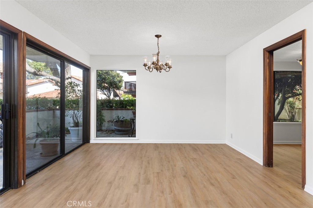 6200 Riviera Circle Long Beach, CA 90815 - Photo 7 of 35 a view of a room with wooden floor staircase and windows