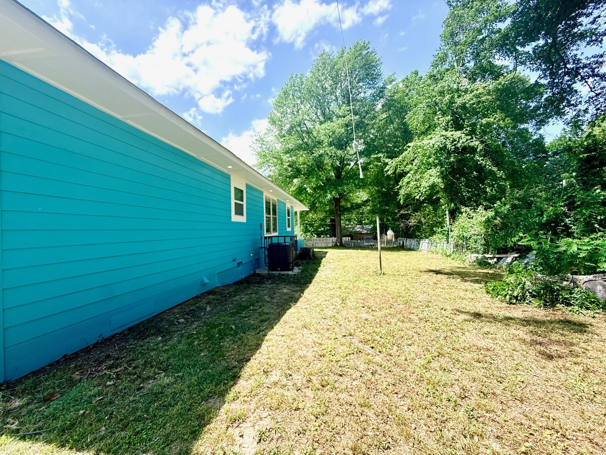 3054 Lotus Road Memphis, TN 38109 - Photo 28 of 29 Turquoise horizontal siding with white trim