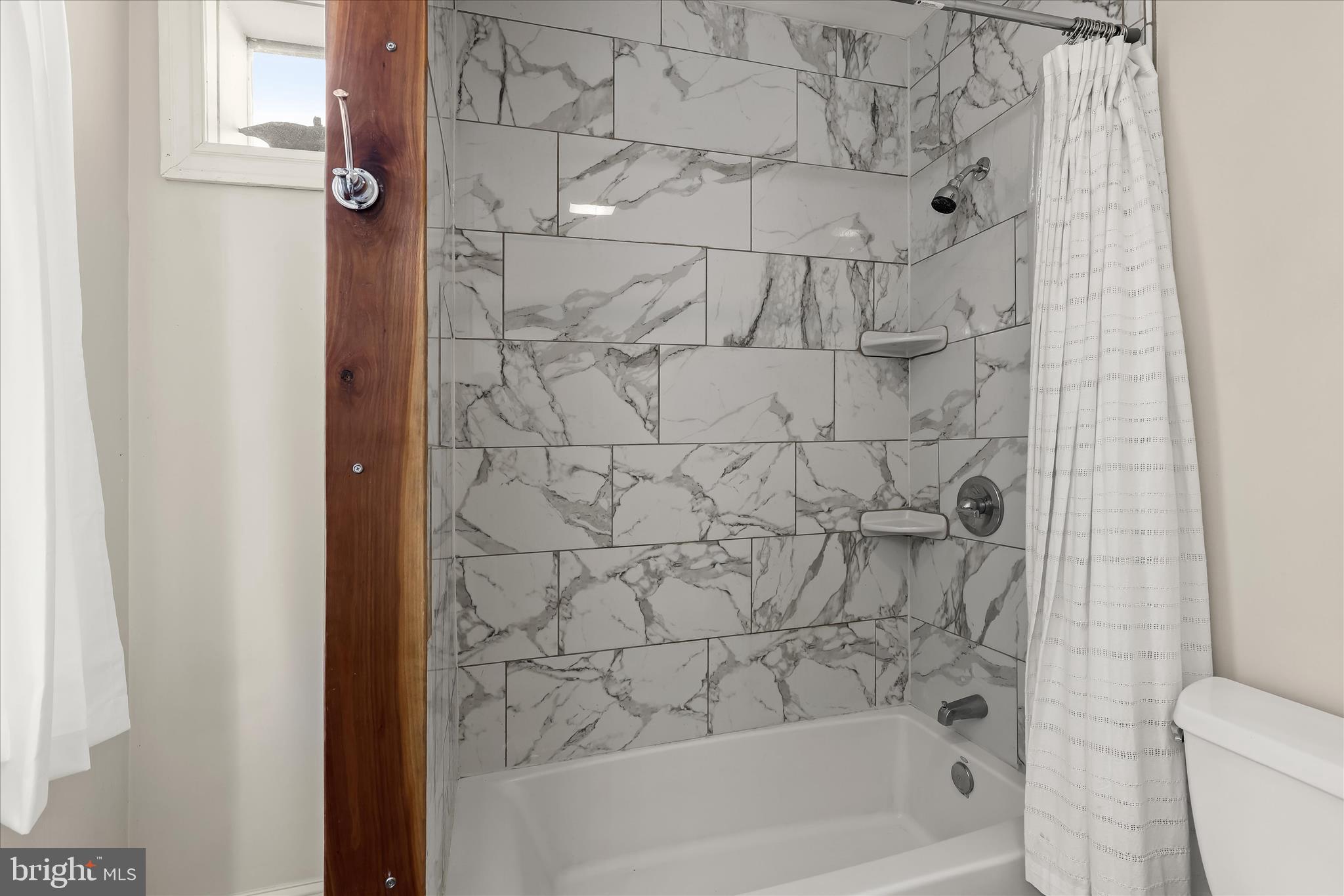 2820 East Baltimore Street Baltimore, MD 21224 - Photo 23 of 45 a bathroom with a bathtub and a shower