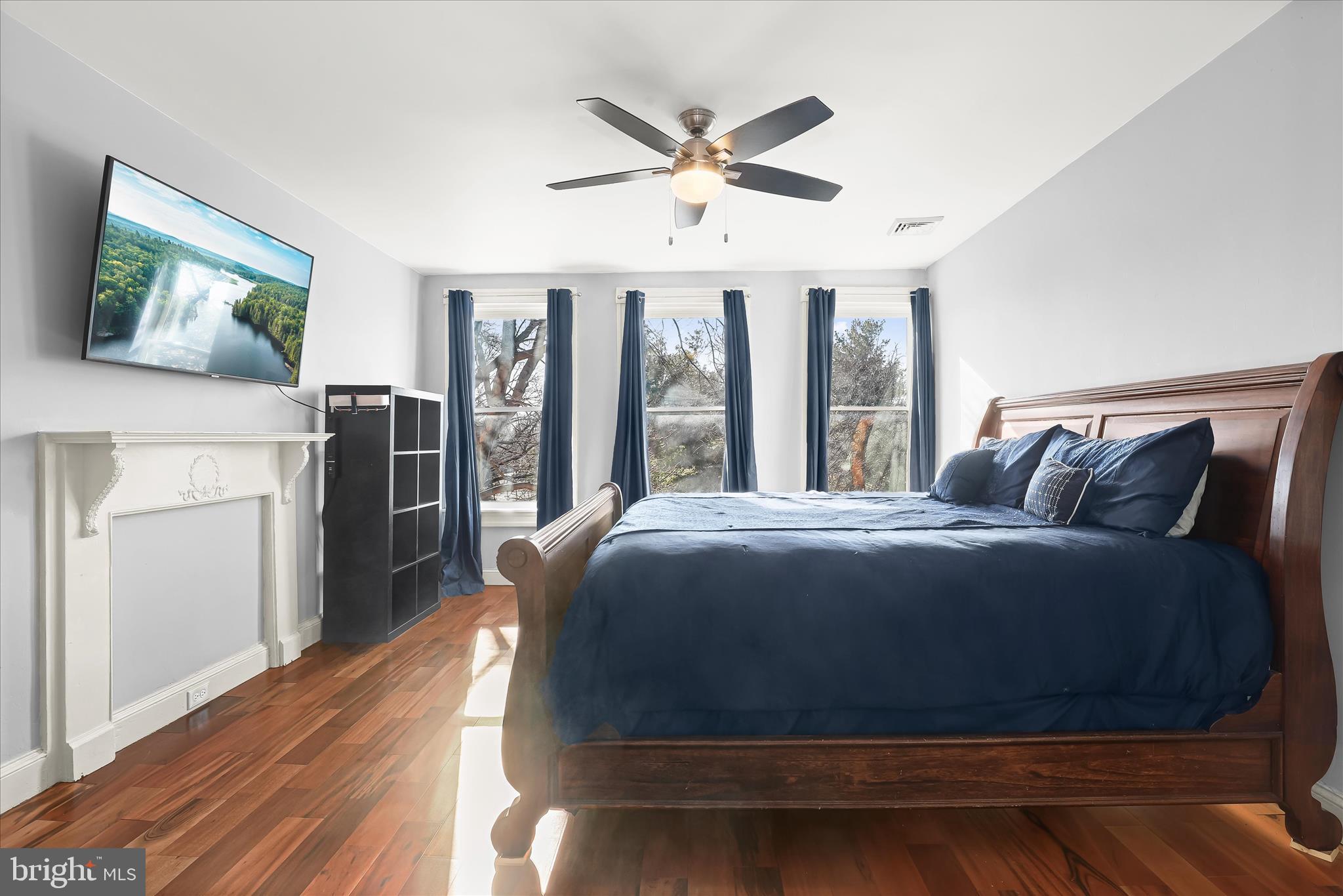 2820 East Baltimore Street Baltimore, MD 21224 - Photo 26 of 45 a bedroom with a bed and a ceiling fan