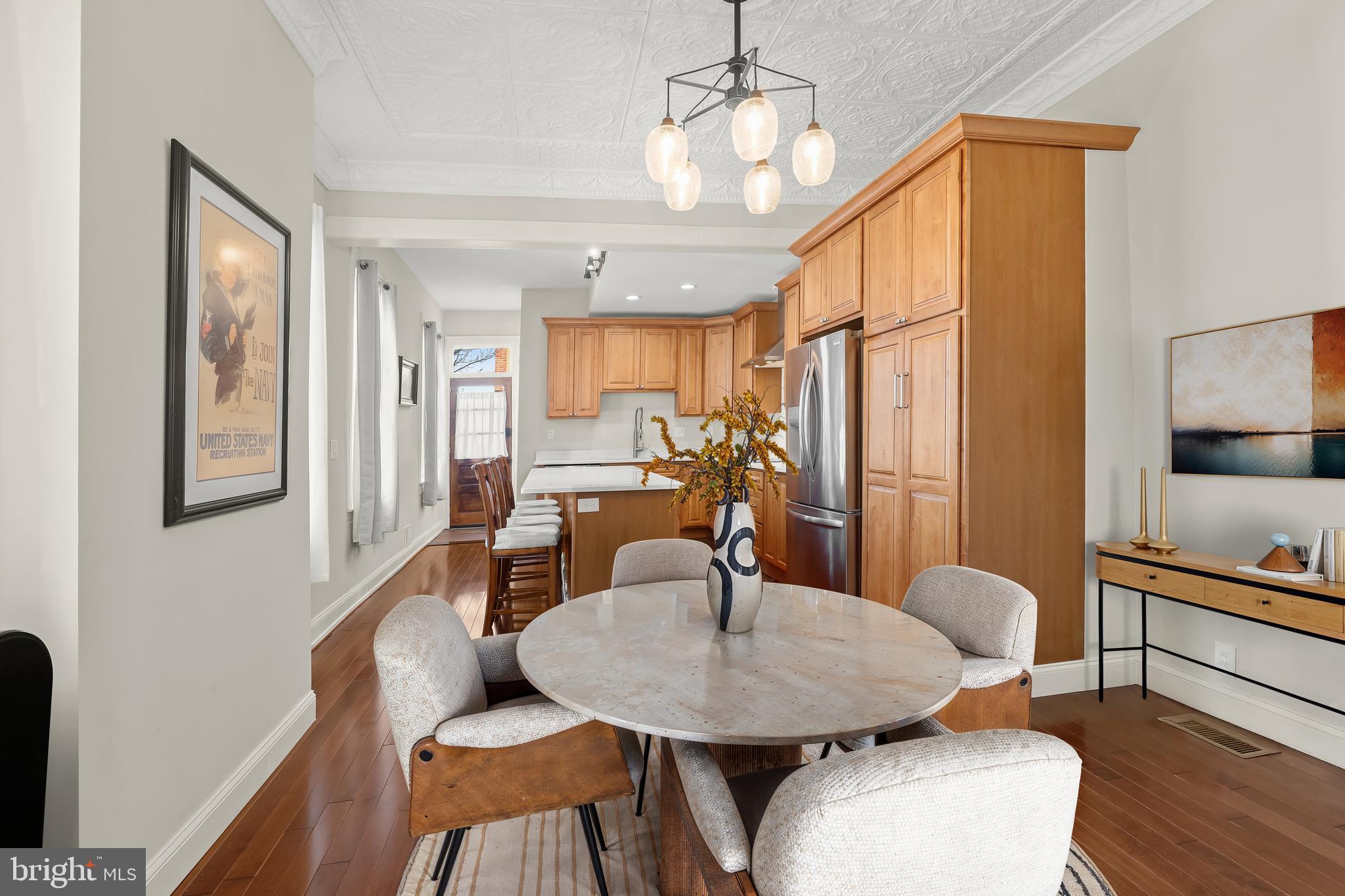 2820 East Baltimore Street Baltimore, MD 21224 - Photo 3 of 45 a view of a dining room with furniture and wooden floor