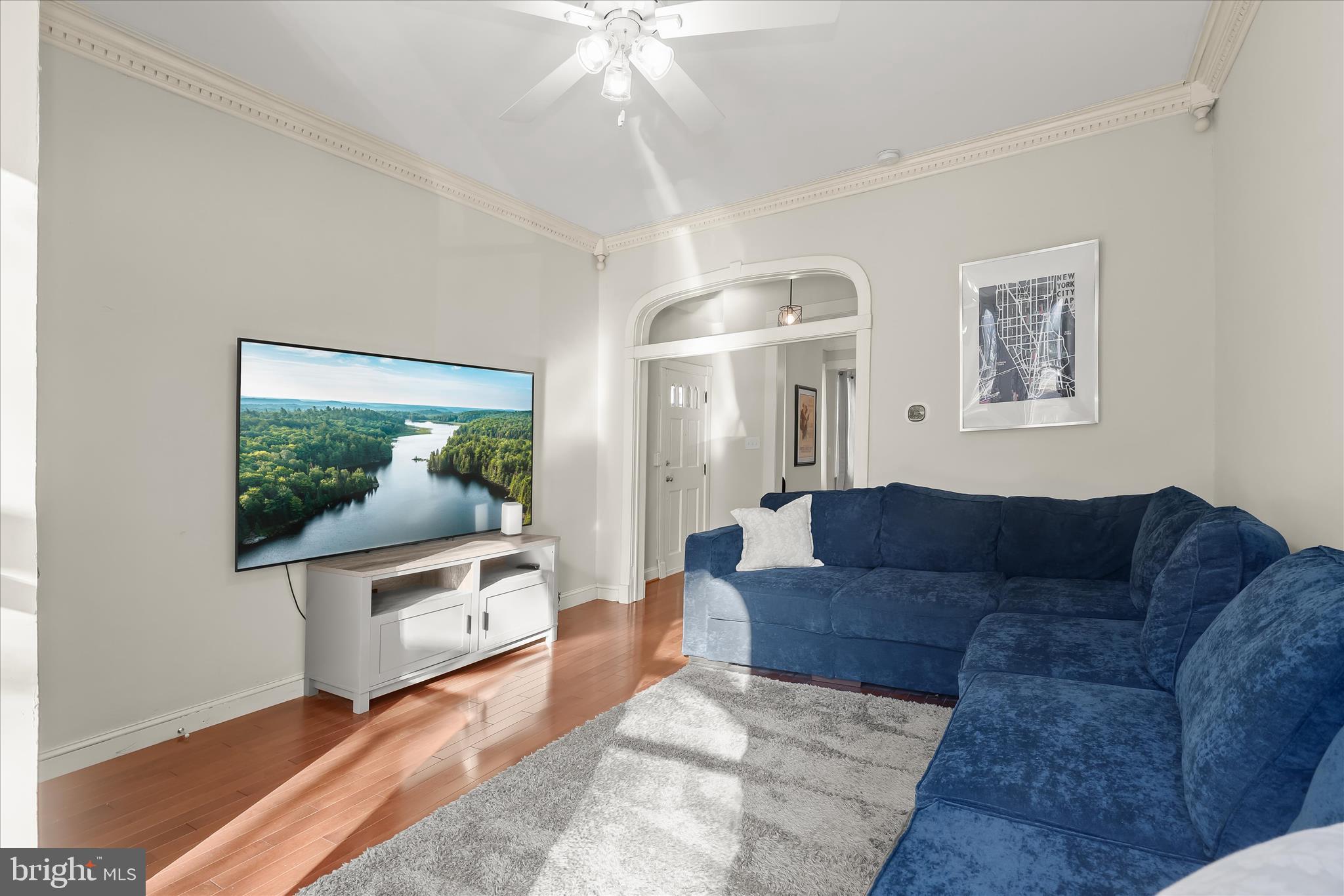 2820 East Baltimore Street Baltimore, MD 21224 - Photo 8 of 45 a living room with furniture and a flat screen tv