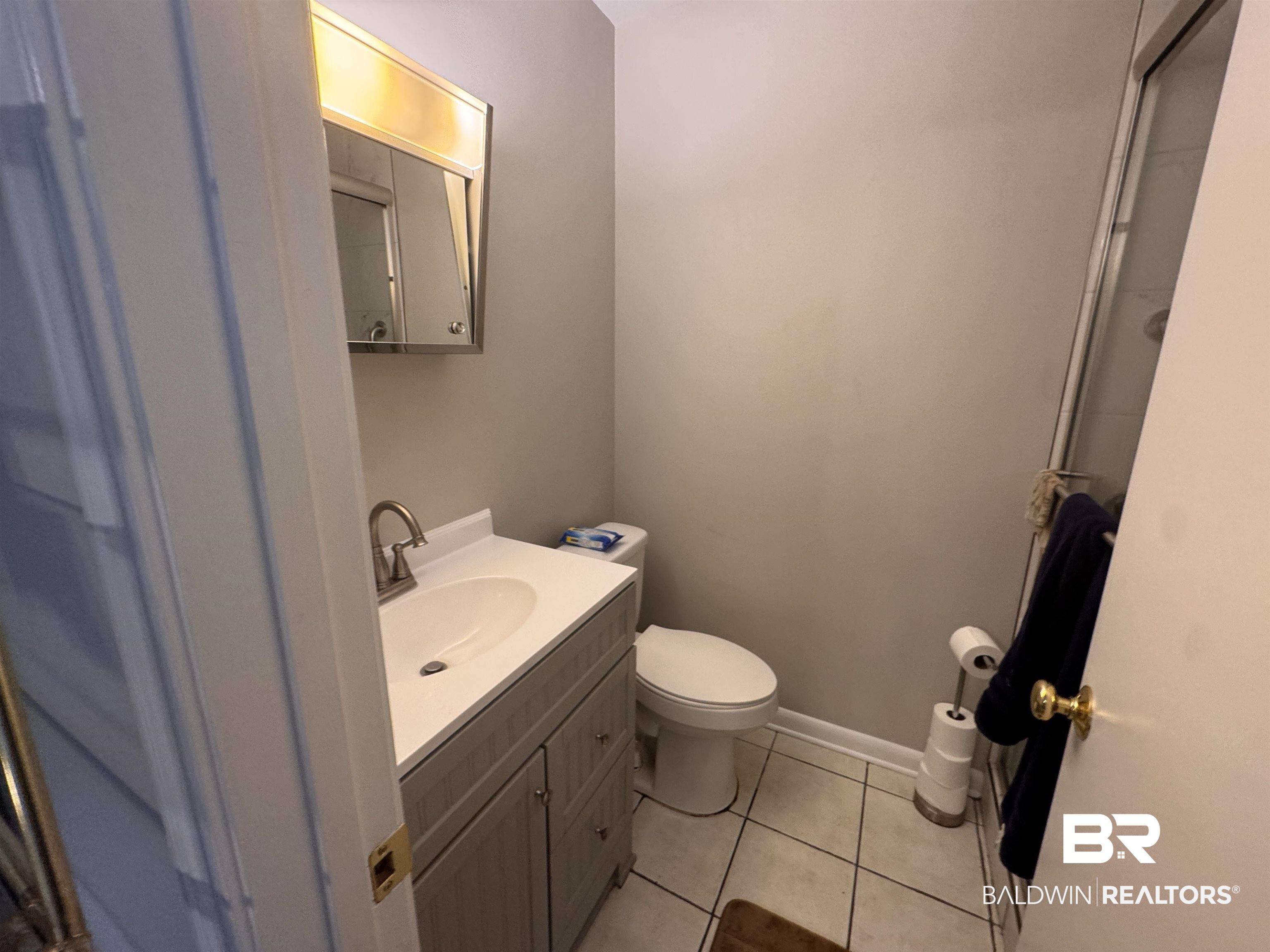 15148 Highland Circle Foley, AL 36535 - Photo 25 of 47 Bathroom with toilet, vanity, and tile patterned flooring