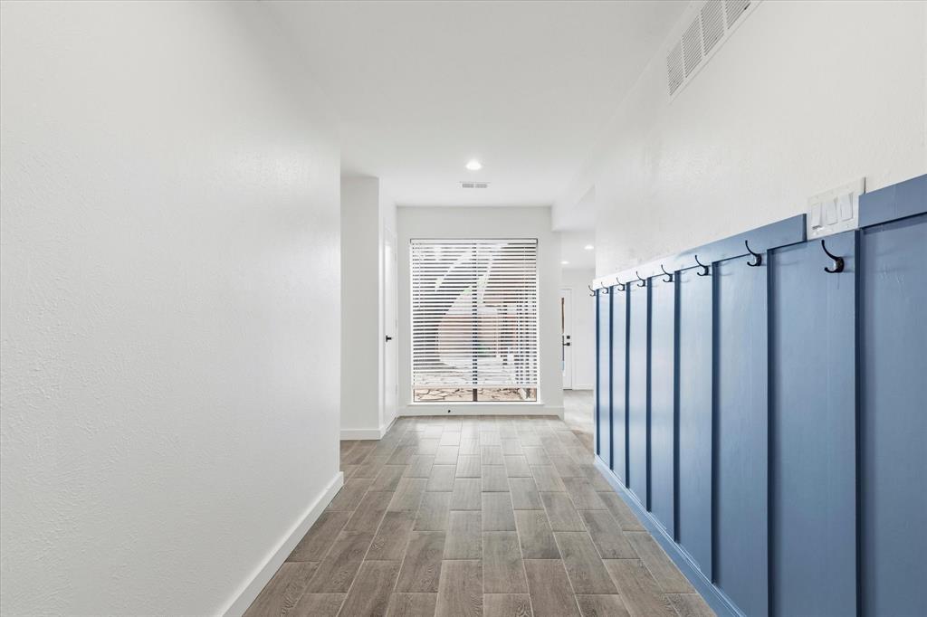 17003 Davenport Road Dallas, TX 75248 - Photo 4 of 40 a view of a hallway with wooden floor