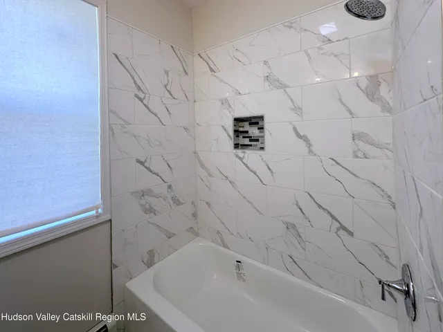 a bathroom with a bathtub