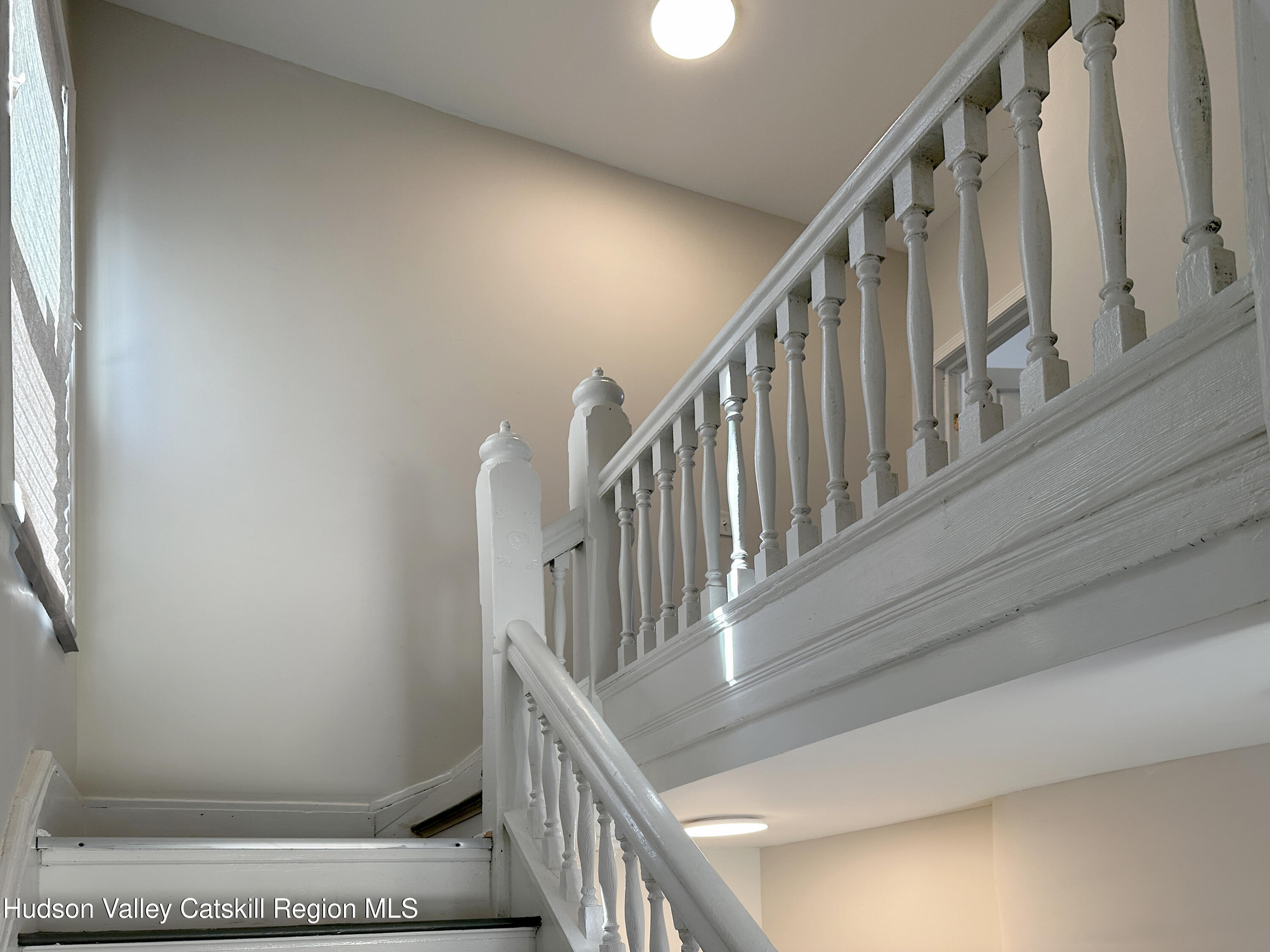 228 Mansion Street Poughkeepsie, NY 12601 - Photo 14 of 35 a view of staircase with railing and white walls