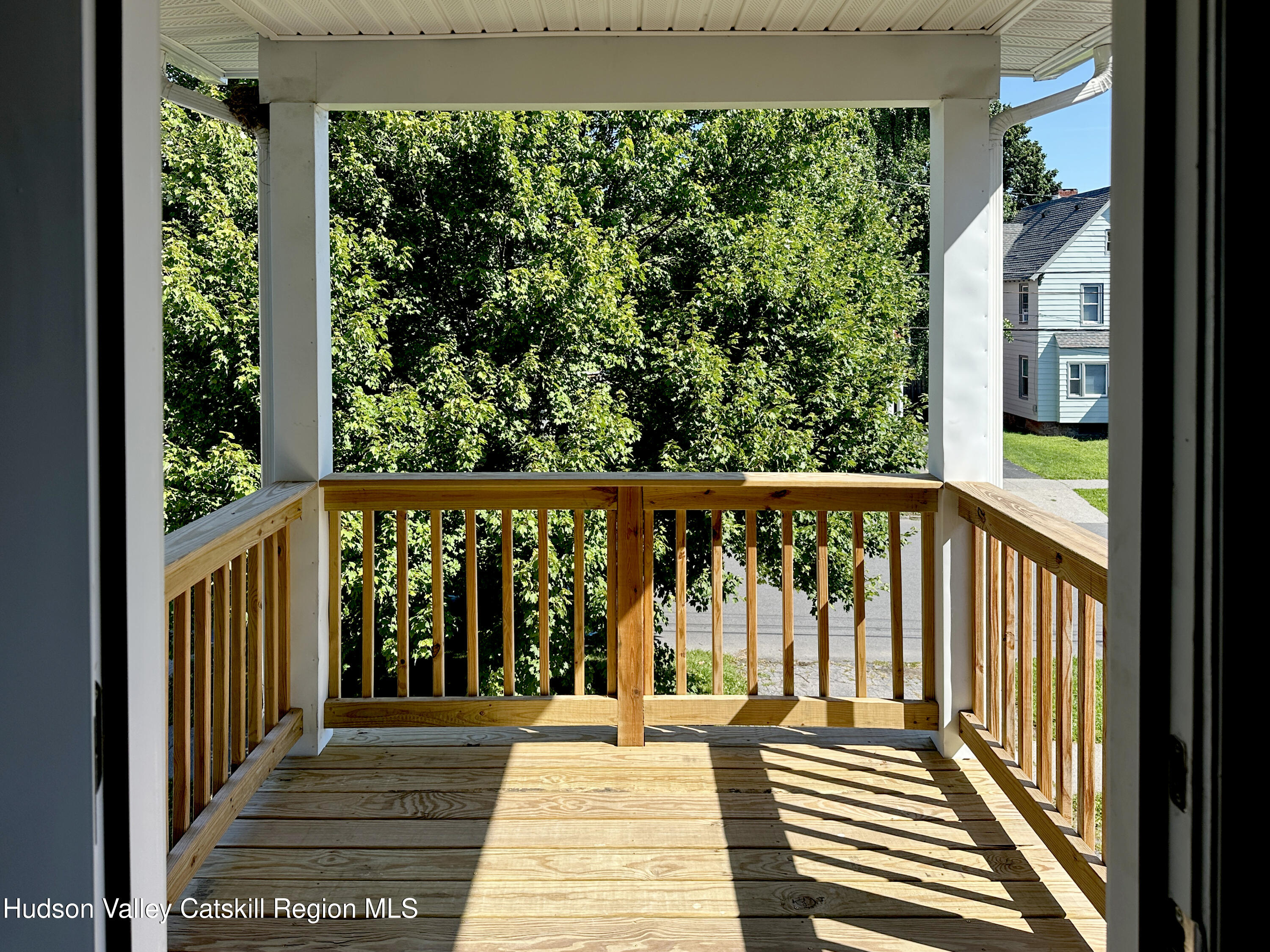 228 Mansion Street Poughkeepsie, NY 12601 - Photo 15 of 35 a view of a balcony with wooden floor