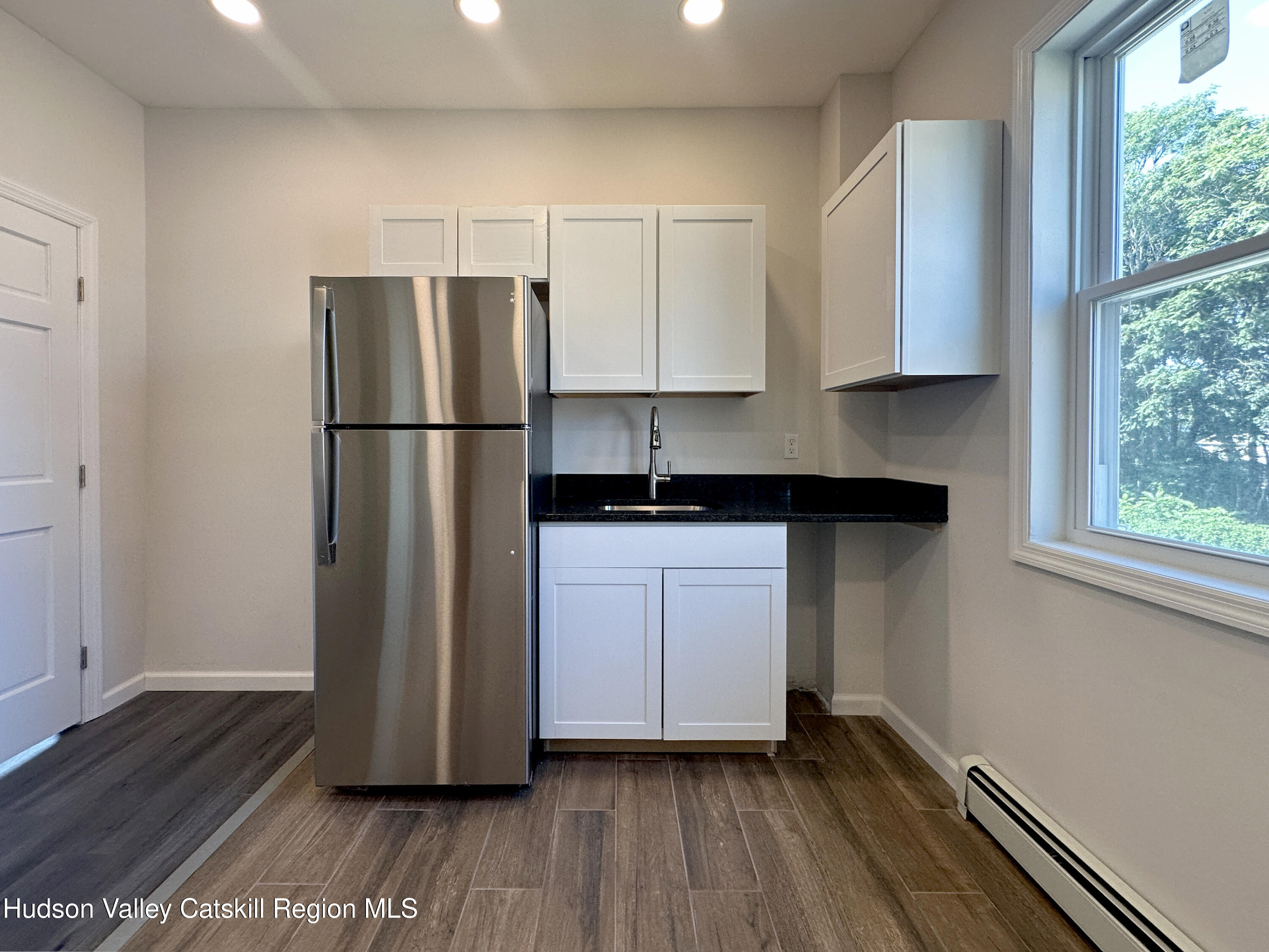 228 Mansion Street Poughkeepsie, NY 12601 - Photo 20 of 35 a kitchen with a refrigerator and a sink