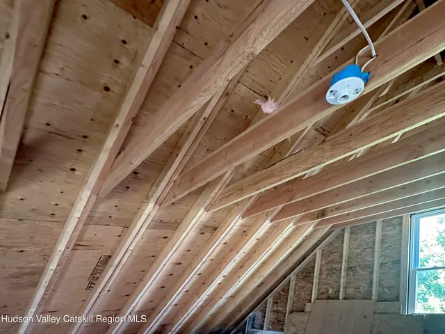 a living room with furniture a fireplace and a table