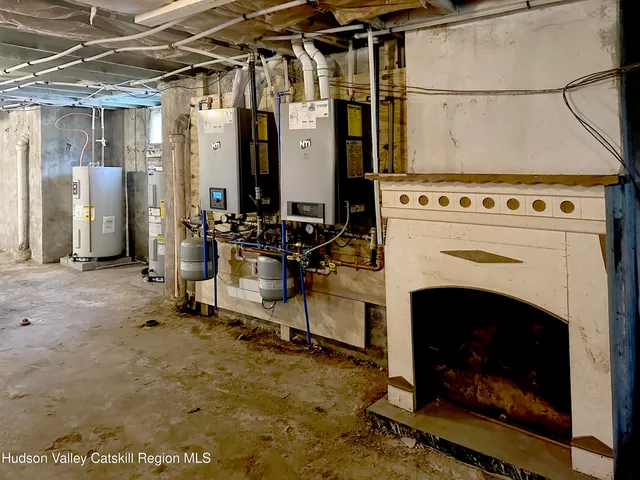 a view of a living room with a fireplace and a faucet