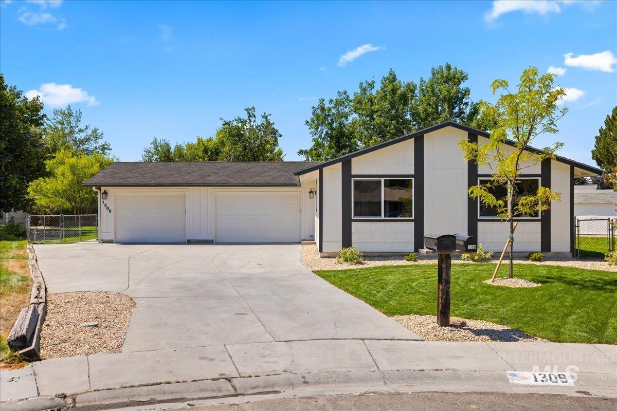 1309 West Maple Avenue Meridian, ID 83642 - Photo 2 of 50 Single story home featuring a garage and driveway