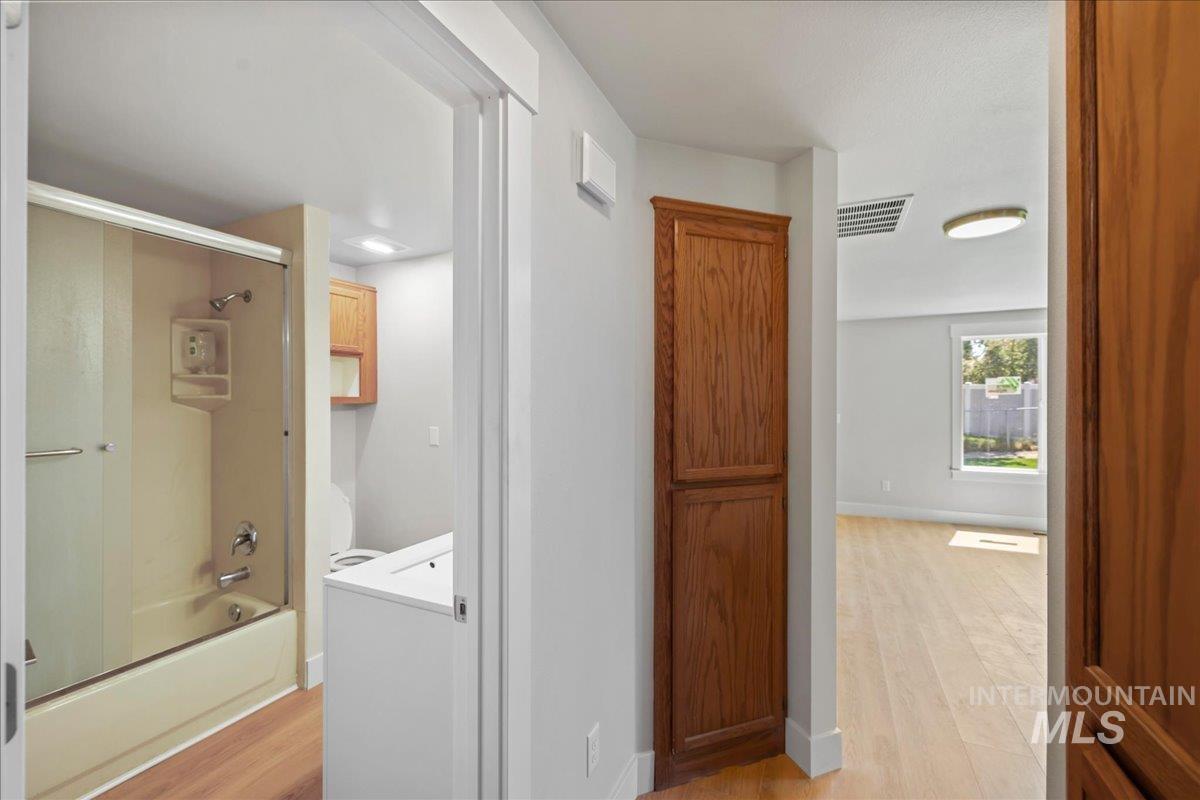 1309 West Maple Avenue Meridian, ID 83642 - Photo 23 of 50 Hallway with light wood-type flooring and baseboards