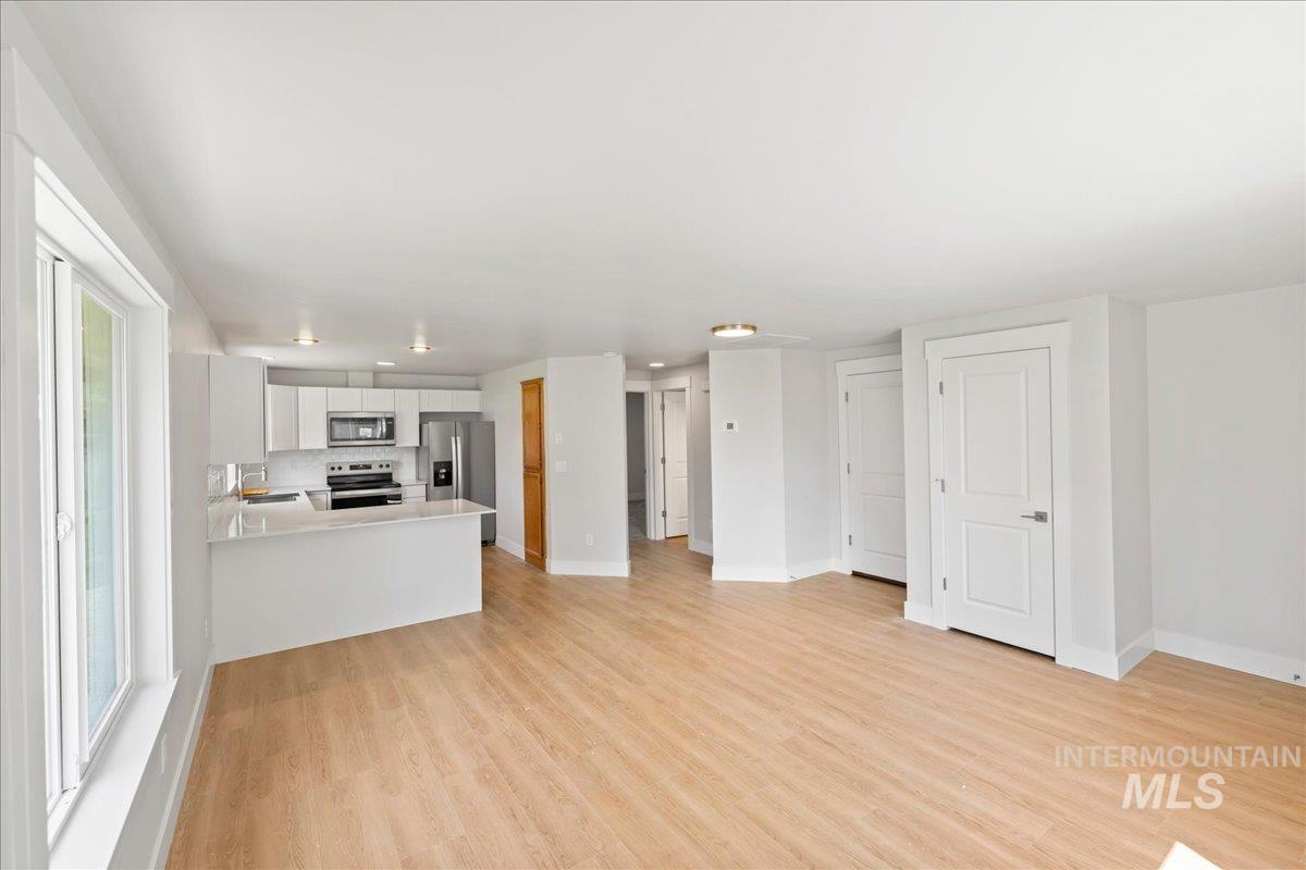1309 West Maple Avenue Meridian, ID 83642 - Photo 28 of 50 Unfurnished living room with light wood finished floors