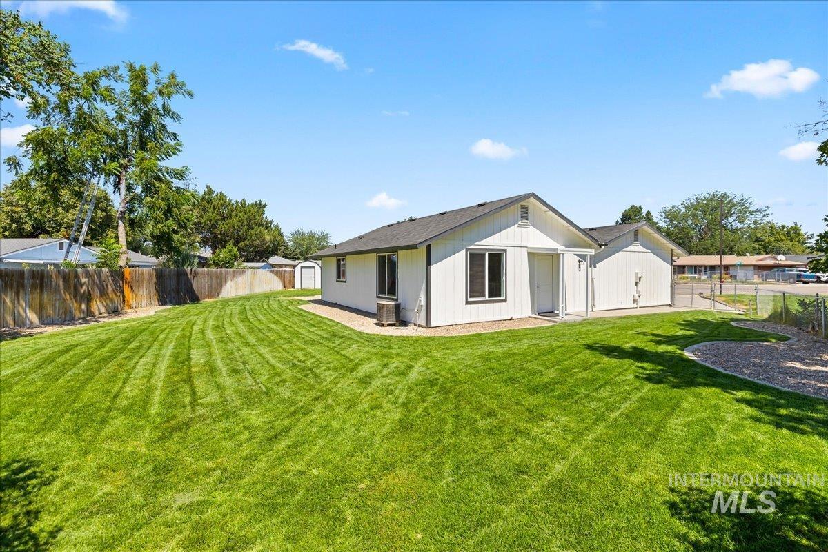 1309 West Maple Avenue Meridian, ID 83642 - Photo 35 of 50 Rear view of house featuring a fenced backyard