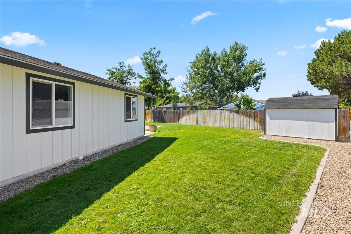 1309 West Maple Avenue Meridian, ID 83642 - Photo 37 of 50 Fenced backyard with a storage unit