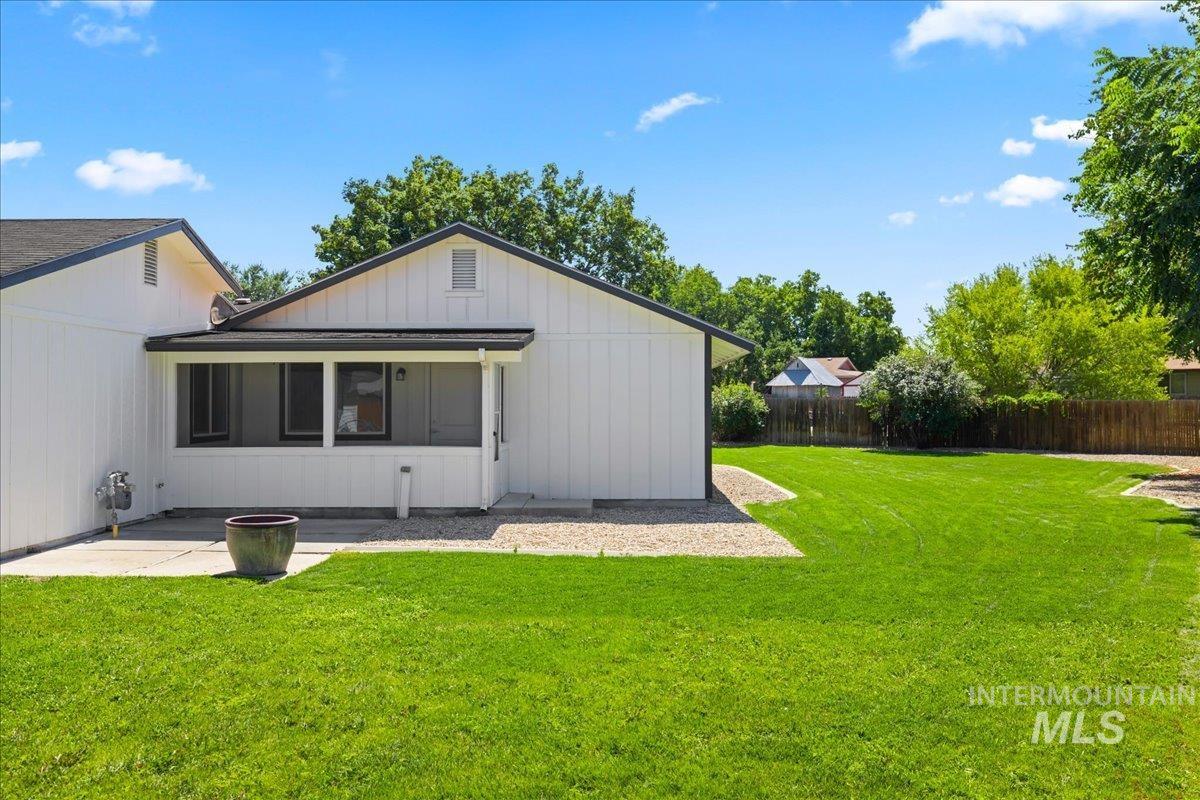1309 West Maple Avenue Meridian, ID 83642 - Photo 39 of 50 Rear view of house with a patio and board and batten siding