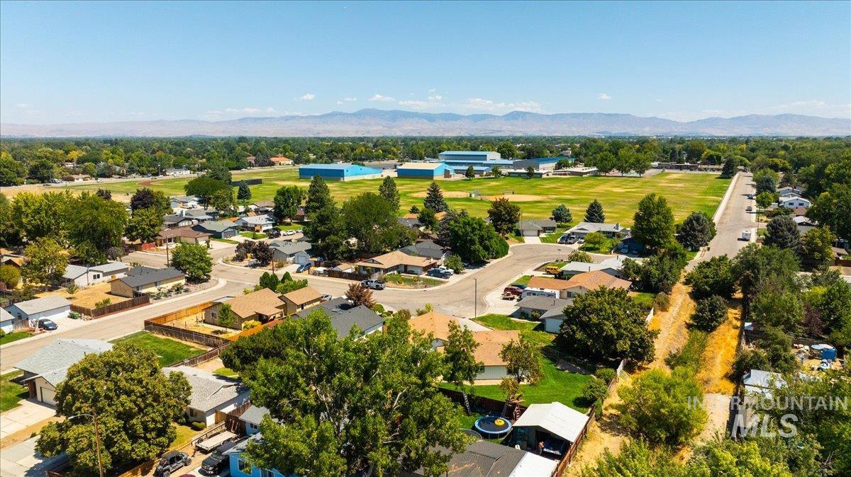 1309 West Maple Avenue Meridian, ID 83642 - Photo 46 of 50 Aerial perspective of suburban area featuring a mountain backdrop