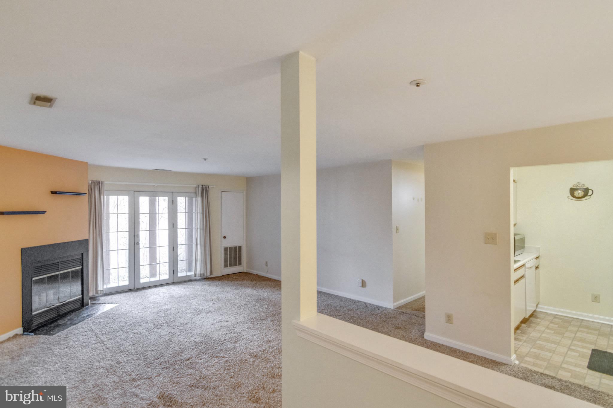 4914 Columbia Road, Unit 3 Columbia, MD 21044 - Photo 8 of 30 Living Room w/ Wood Burning Fireplace