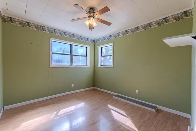 a view of room with window and ceiling fan