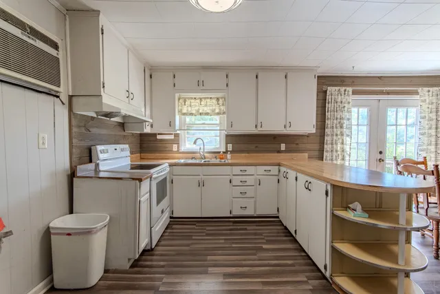 a kitchen with sink and cabinets