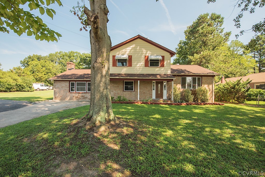 1593 Baxter Road Prince George, VA 23875 - Photo 1 of 29 front view of a house with a yard