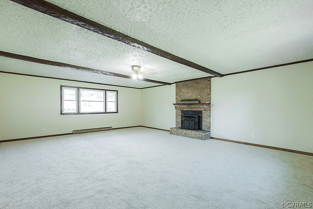 1593 Baxter Road Prince George, VA 23875 - Photo 13 of 29 an empty room with fireplace and windows