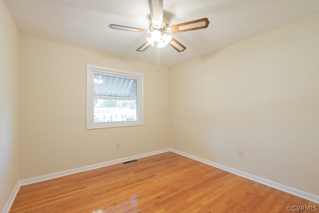1593 Baxter Road Prince George, VA 23875 - Photo 19 of 29 an empty room with a window and a fan