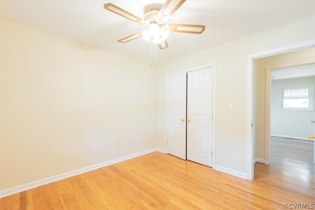 1593 Baxter Road Prince George, VA 23875 - Photo 20 of 29 a view of a room with wooden floor and a ceiling fan