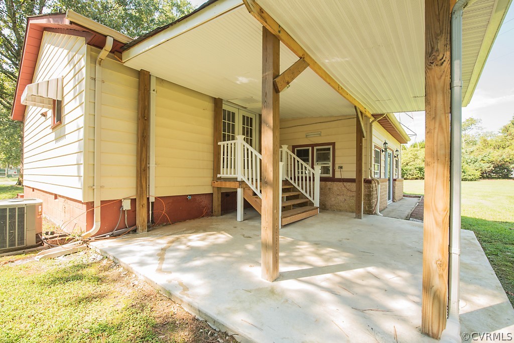 1593 Baxter Road Prince George, VA 23875 - Photo 26 of 29 a view of a house with a backyard and a tub