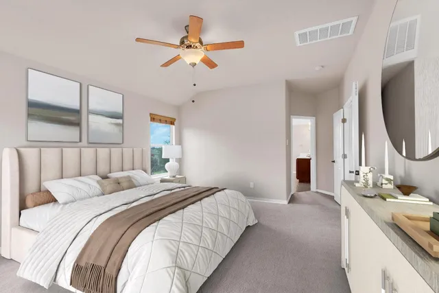 a bedroom with a large bed a chandelier and a flat tv screen