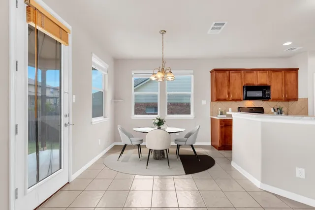 a dining room with furniture and window