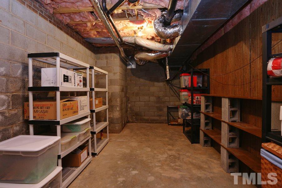 10420 Whitestone Road Raleigh, NC 27615 - Photo 22 of 24 This cool space in basement would make the perfect wine cellar. Craft room, exercise room or just old old storage!