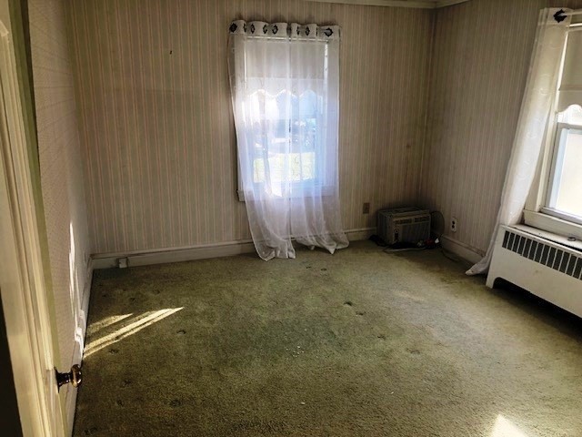 165 11th Street Lowell, MA 01850 - Photo 15 of 21 a view of a room that has a window and a door in it